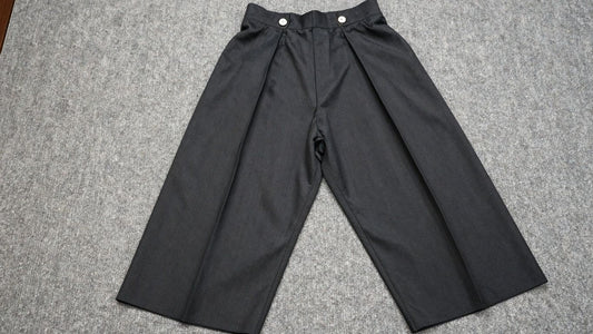 Stylish black hakama pants, modern traditional Japanese attire.