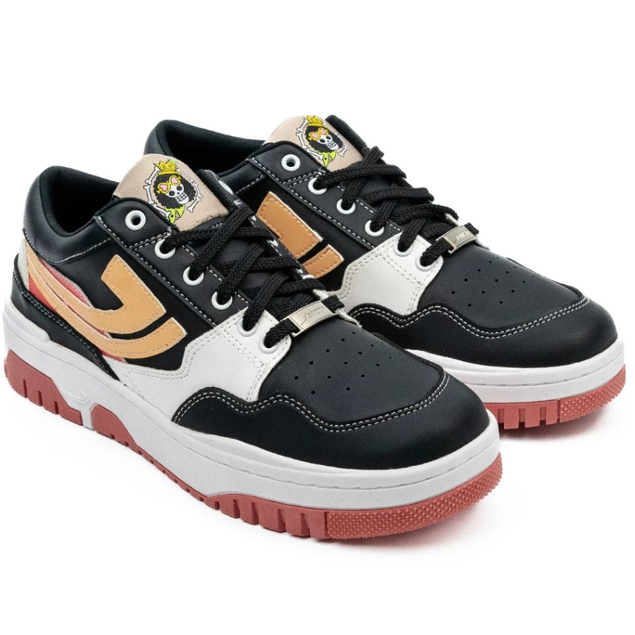 Side profile of black and white One Piece Brook sneaker with peach outsole