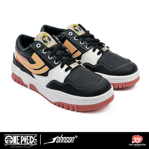 Side profile of black and white One Piece Brook sneaker with peach outsole