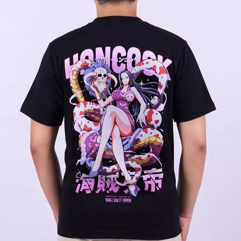 A man wearing a black short-sleeve graphic t-shirt, viewed from the back. The shirt features a large anime-style print of a character with a skull and a pink-and-white striped snake on the back, with the text 'HONCOCK' and Japanese characters.
